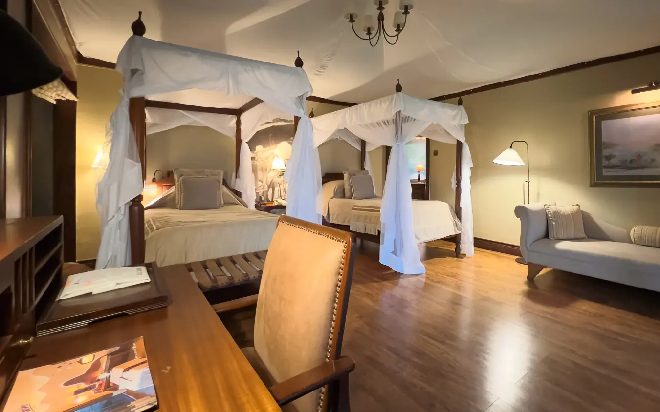 Luxury suite with canopy beds and polished hardwood floors, Lake Elmenteita Serena Camp, Rift Valley Lakes, Kenya