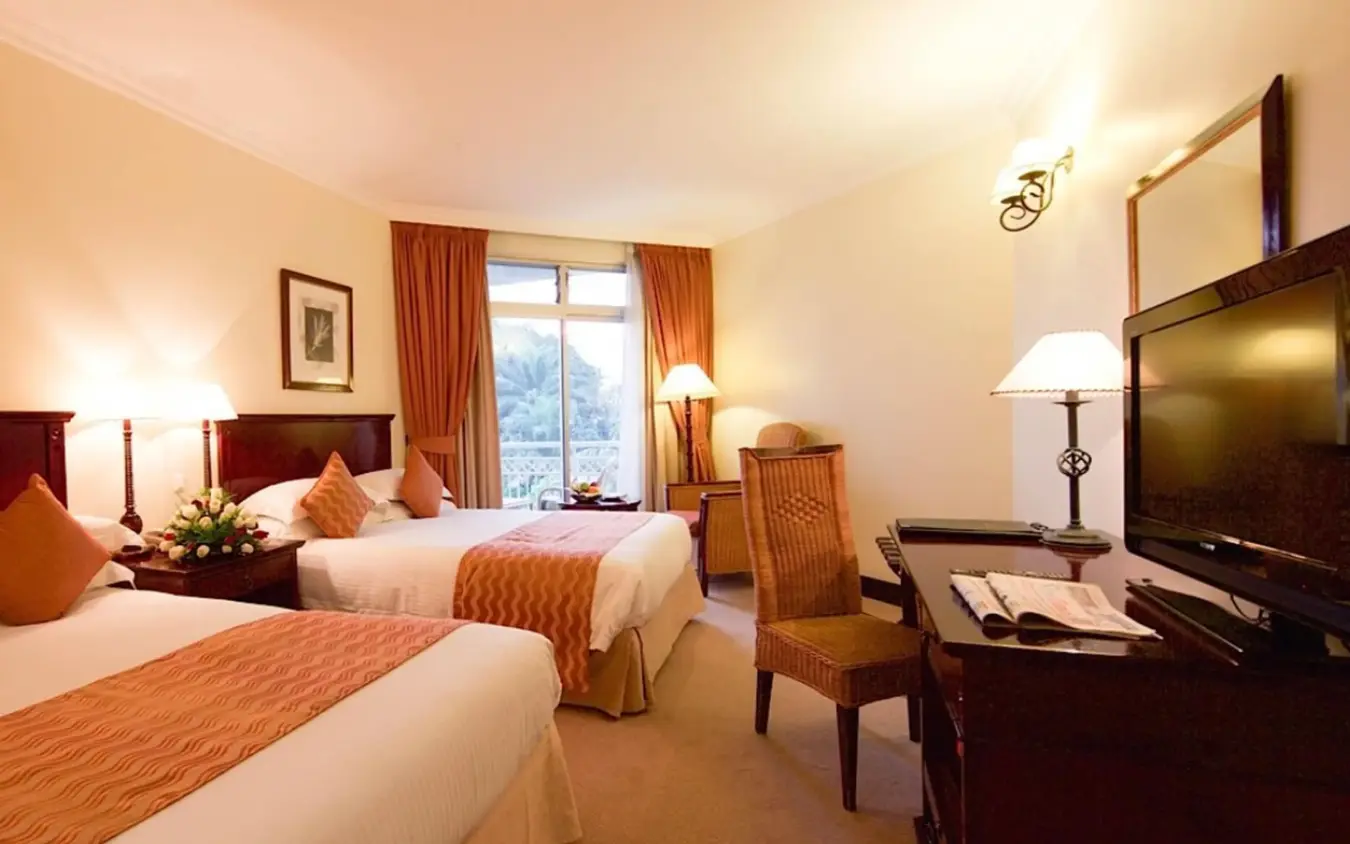 Twin beds with lake view and evening lighting, Lake Kivu Serena Hotel, Lake Kivu, Rwanda