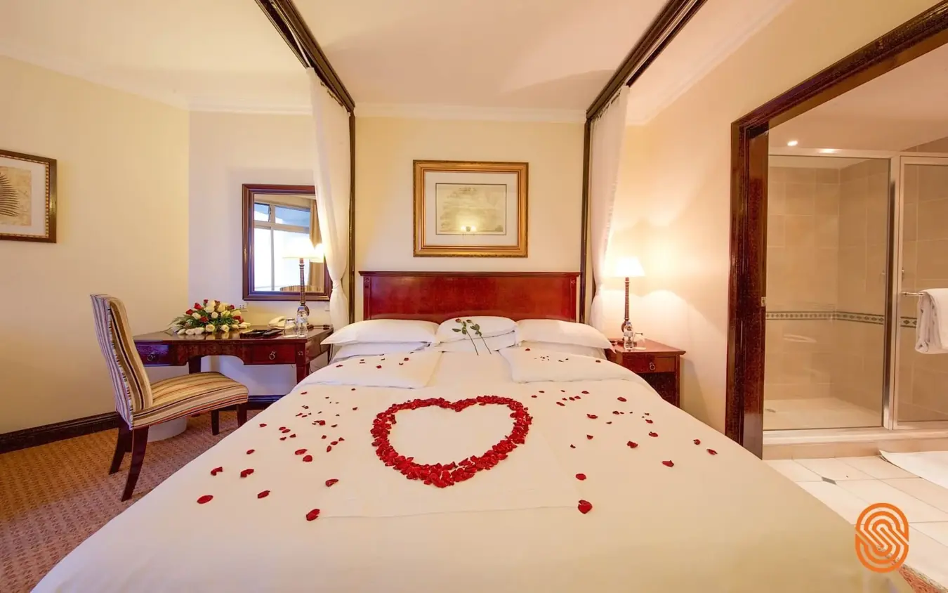 Bedroom with canopy bed and rose petal decoration, Lake Kivu Serena Hotel, Lake Kivu, Rwanda