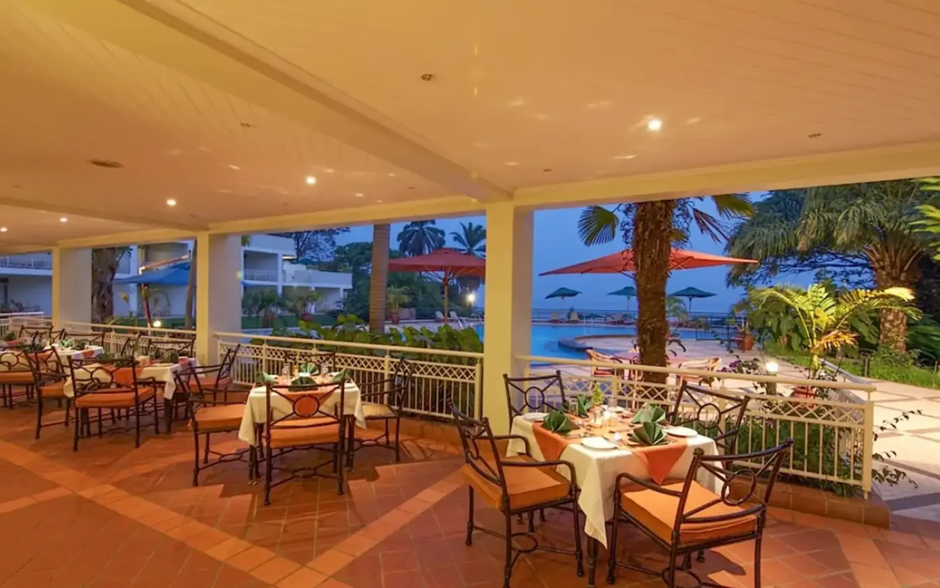 Covered lounge area with lake views and palm trees, Lake Kivu Serena Hotel, Lake Kivu, Rwanda