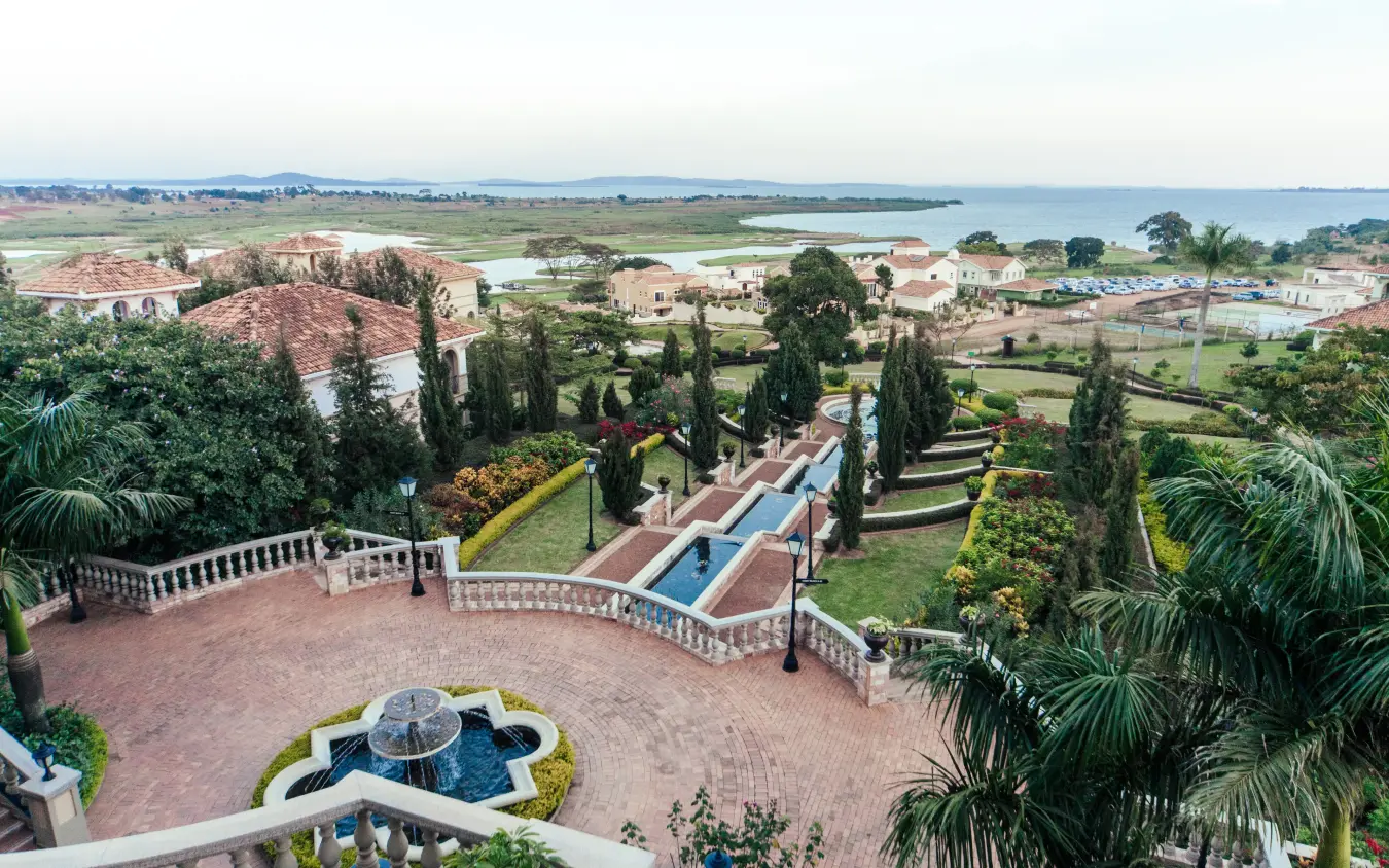 Aerial view of luxury estate with manicured gardens and lake vista beyond, Lake Victoria Serena Golf Resort & Spa, Entebbe and Kampala, Uganda
