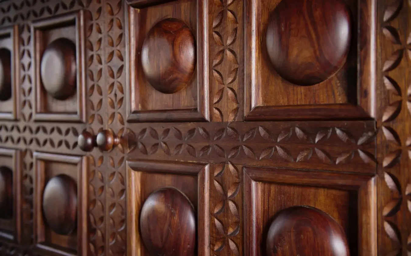 Carved wooden door panels with spherical relief decorations, Serian Serengeti Lamai, Serengeti National Park, Tanzania
