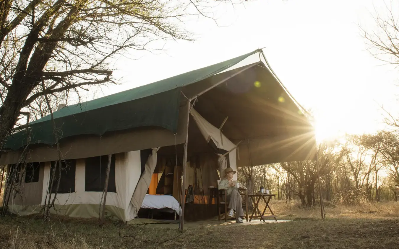 Canvas safari tent with awning at golden hour, Serian Serengeti Lamai, Serengeti National Park, Tanzania
