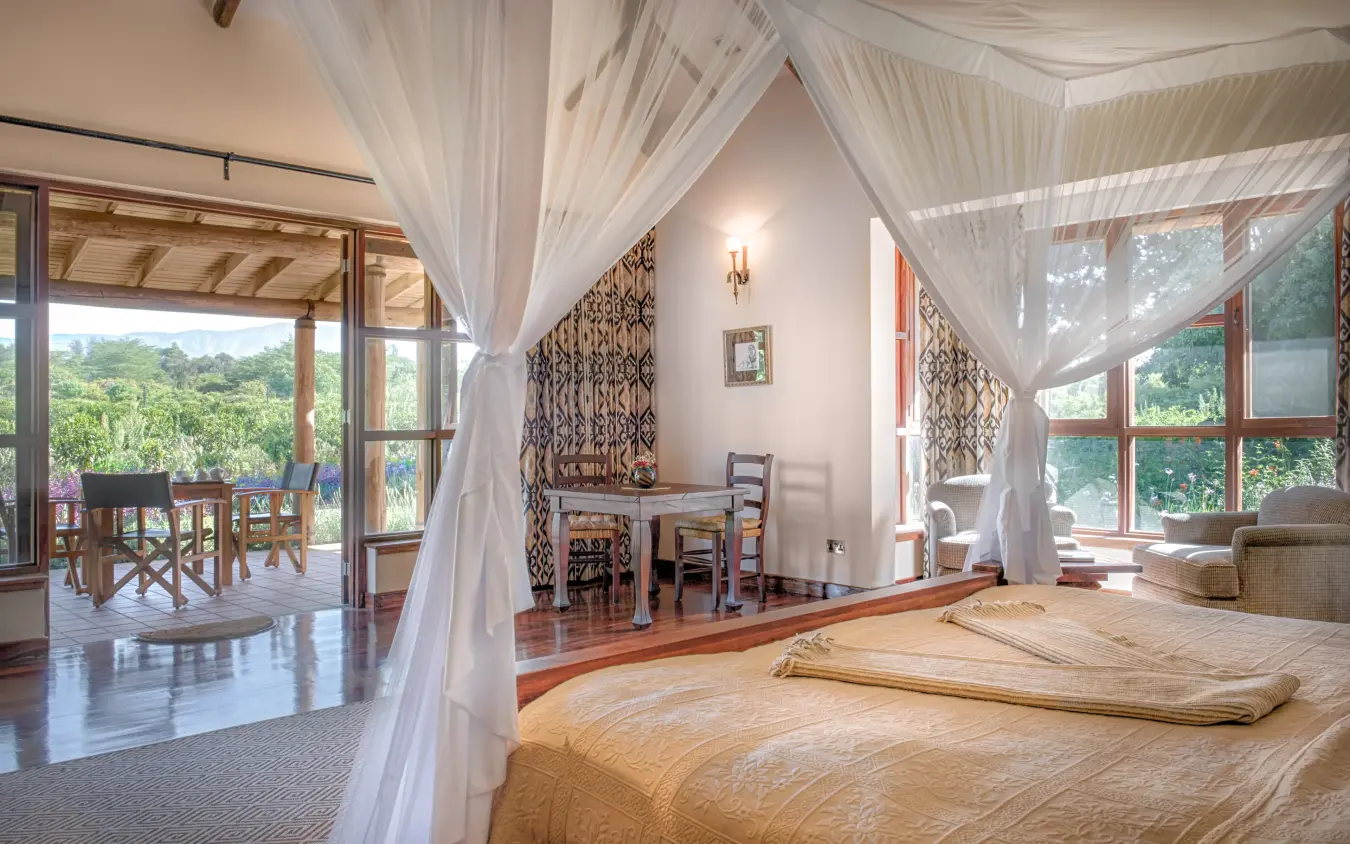 Spacious bedroom with sheer curtains and forest views, Legendary Lodge, Arusha, Tanzania