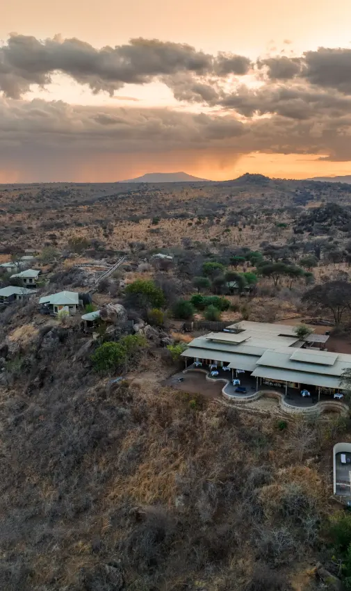 Modern lodge with pool overlooking savanna landscape at sunset, Mpingo Ridge Lodge, Tarangire National Park, Tanzania