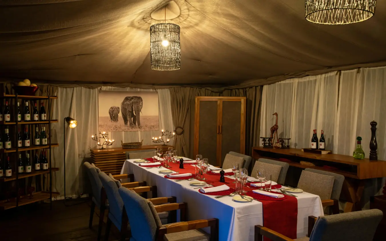 Elegant dining tent with set table and wildlife artwork, Lemala Ngorongoro, Ngorongoro Crater, Tanzania