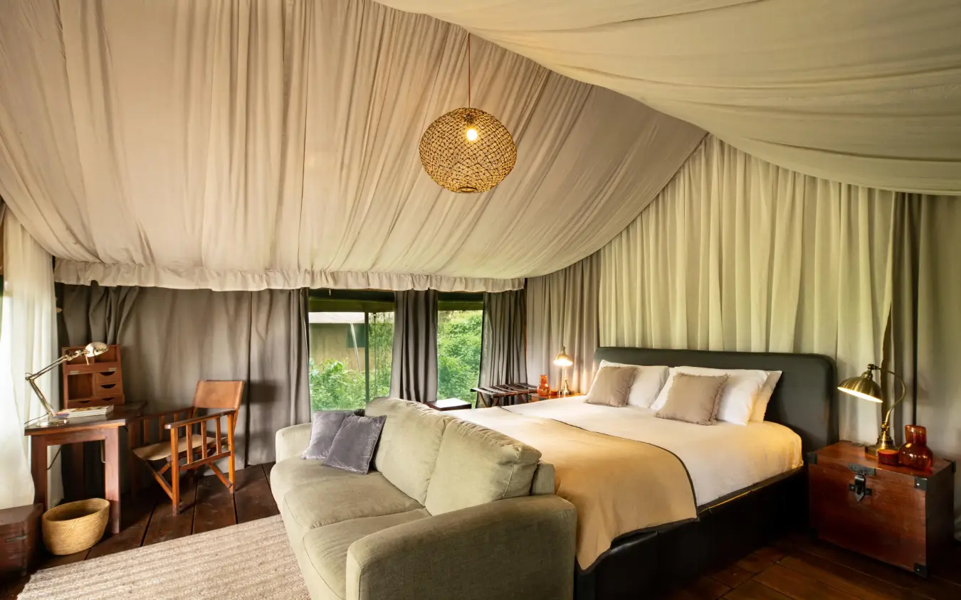 Luxurious tent bedroom with draped ceiling and garden views, Lemala Ngorongoro, Ngorongoro Crater, Tanzania