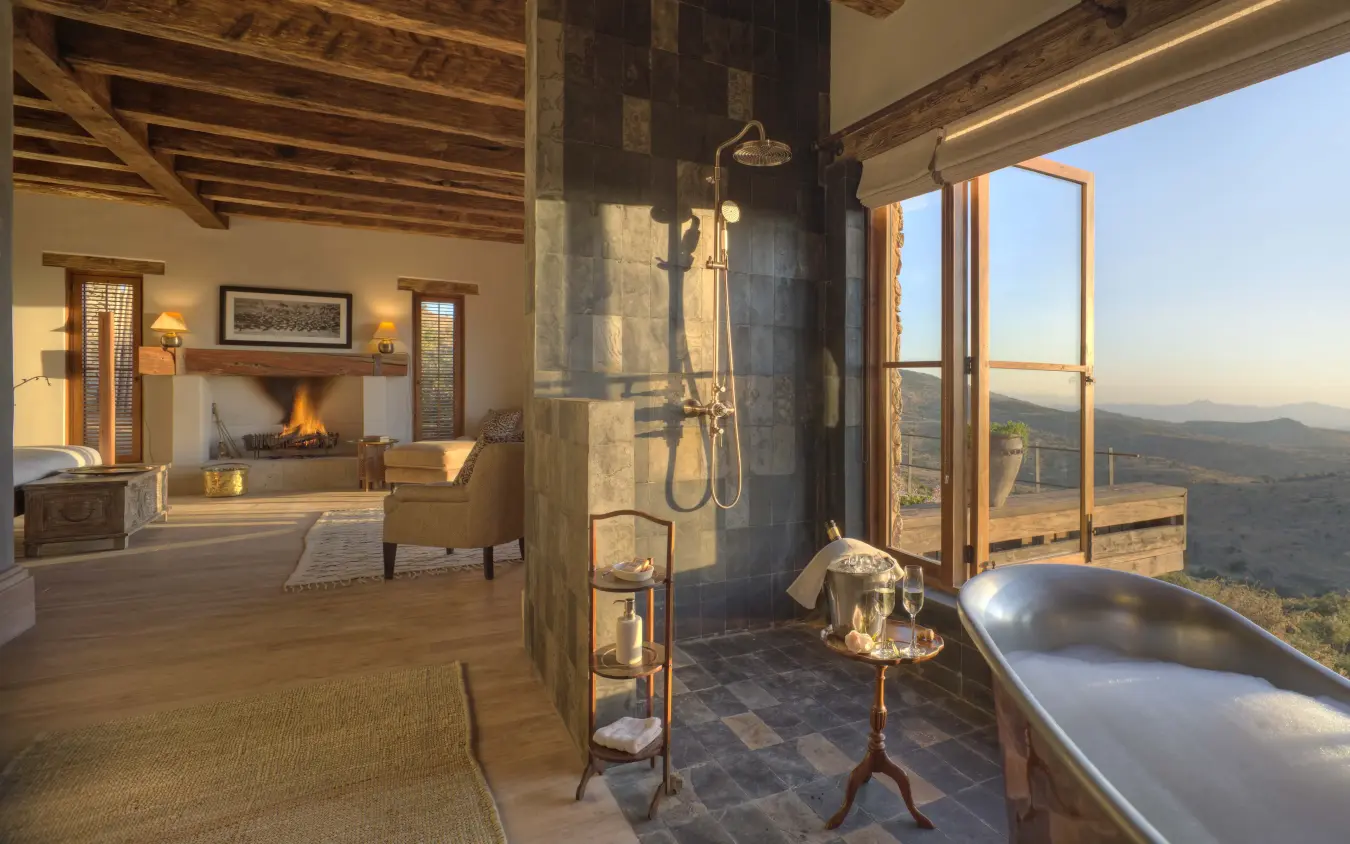 Luxury bathroom with freestanding tub overlooking valley landscape, Lengishu House, Laikipia Highlands, Kenya
