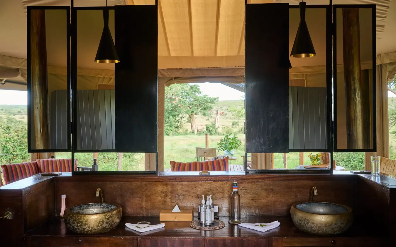 Luxury bathroom vanity with twin vessel sinks overlooking valley landscape, Leopard Hill, Maasai Mara, Kenya