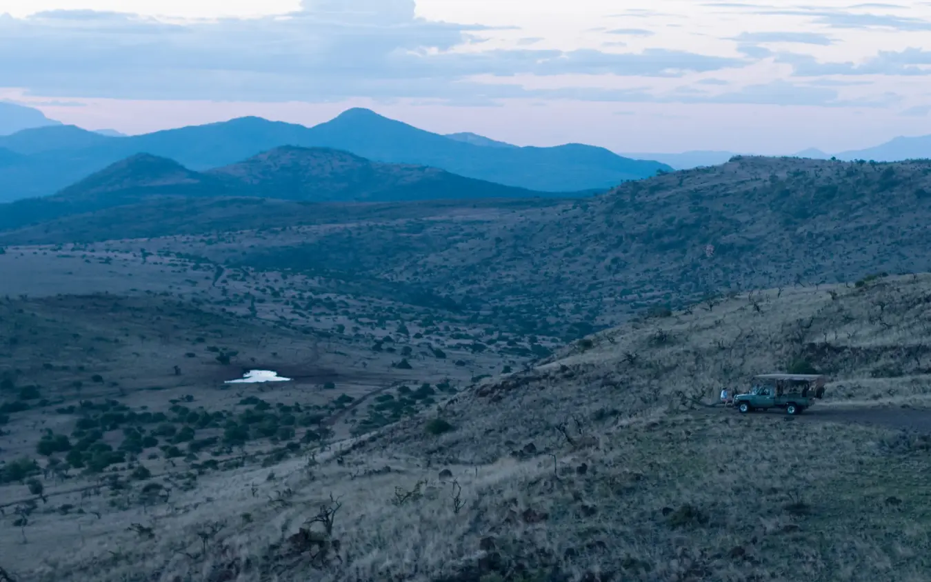 Aerial view of savanna landscape with distant volcanic mountains, Lewa House, Laikipia Highlands, Kenya