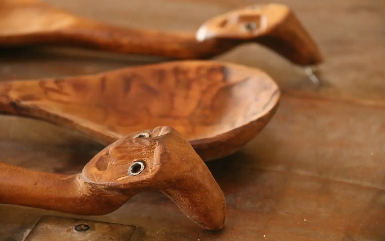Wooden carved bird figurines arranged on surface, Lewa House, Laikipia Highlands, Kenya