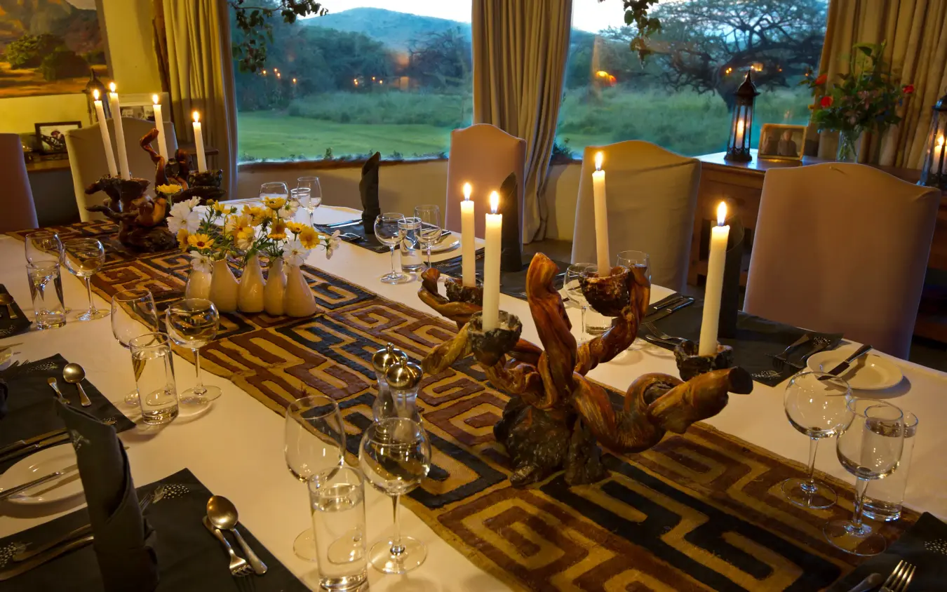 Elegant dining room with table settings and landscape views, Lewa House, Laikipia Highlands, Kenya