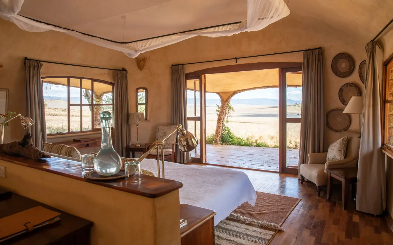 Spacious bedroom with views across savanna landscape, Lewa House, Laikipia Highlands, Kenya