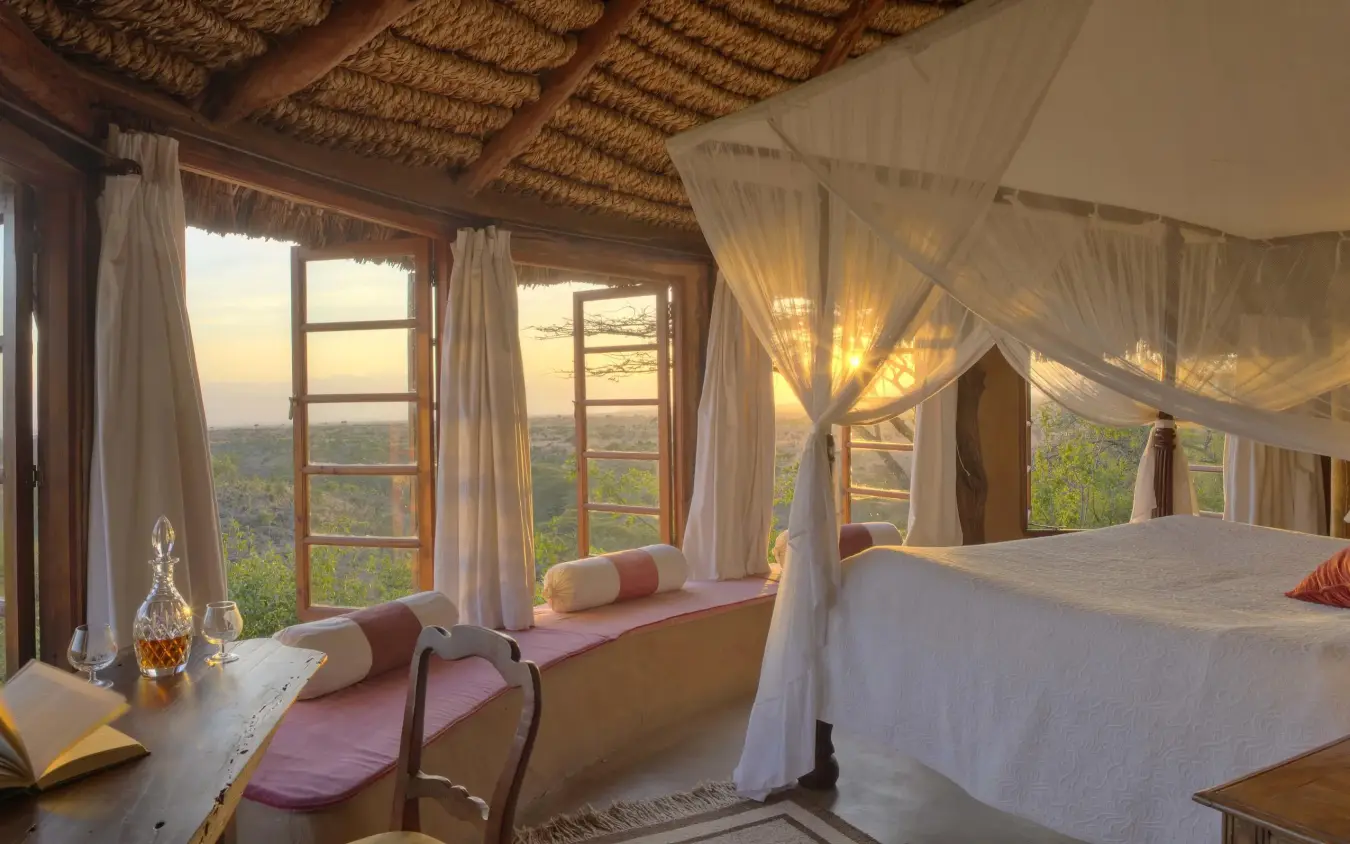 Bedroom with four-poster bed and expansive valley views, Lewa Wilderness, Laikipia Highlands, Kenya