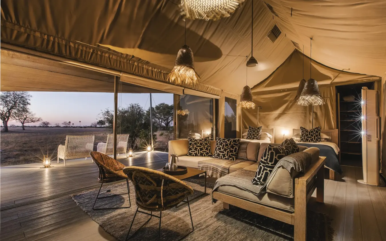 Safari lodge interior tent with seating and game view, Linkwasha Camp, Hwange National Park, Zimbabwe
