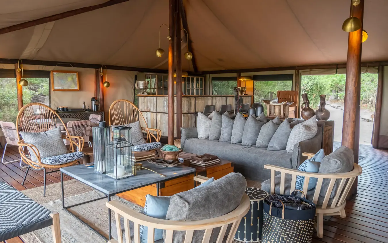 Safari lodge lounge with canvas tent ceiling and wooden furnishings, Linyanti Bush Camp, Linyanti Wildlife Reserve, Botswana