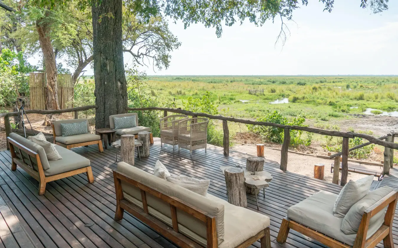 Wooden deck with seating overlooking savanna landscape, Linyanti Ebony, Linyanti Wildlife Reserve, Botswana
