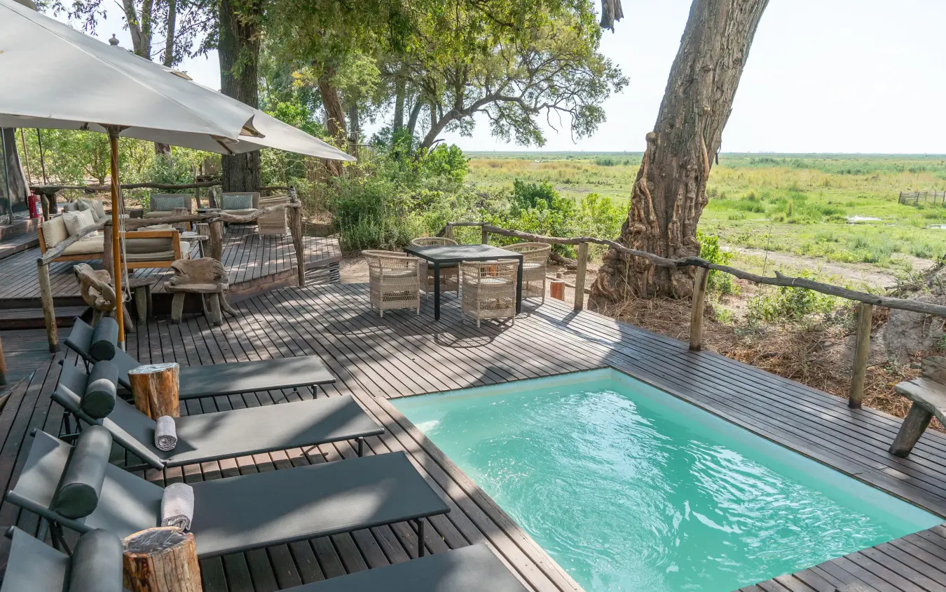 Wooden deck with pool overlooking savanna landscape, Linyanti Ebony, Linyanti Wildlife Reserve, Botswana