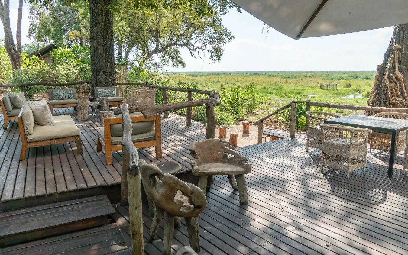 Wooden deck with seating overlooking savanna landscape, Linyanti Ebony, Linyanti Wildlife Reserve, Botswana