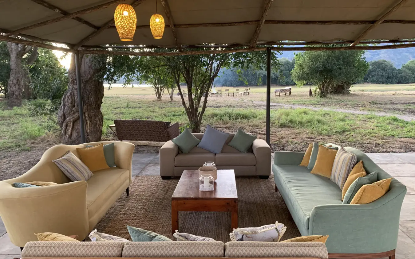 Open-air lounge seating area with savanna views, Little Vundu, Mana Pools, Zimbabwe