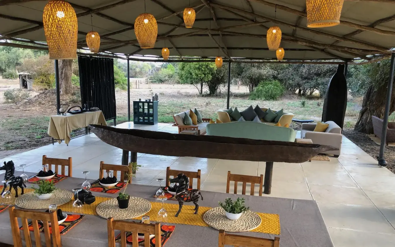 Open-air lounge pavilion with woven pendant lights and seating, Little Vundu, Mana Pools, Zimbabwe