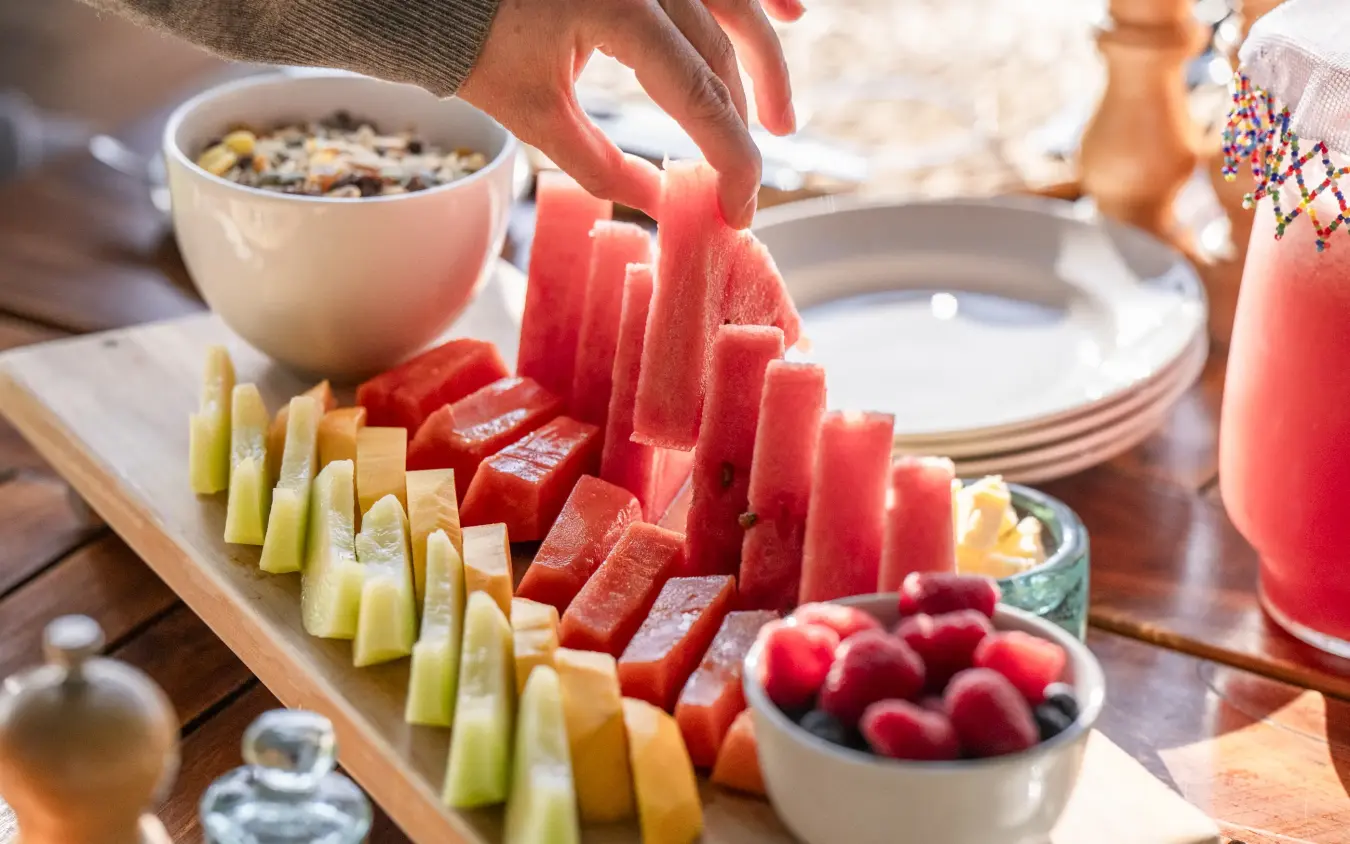 Outdoor dining table with fresh fruit platter and refreshments, Loldia House, Rift Valley Lakes, Kenya