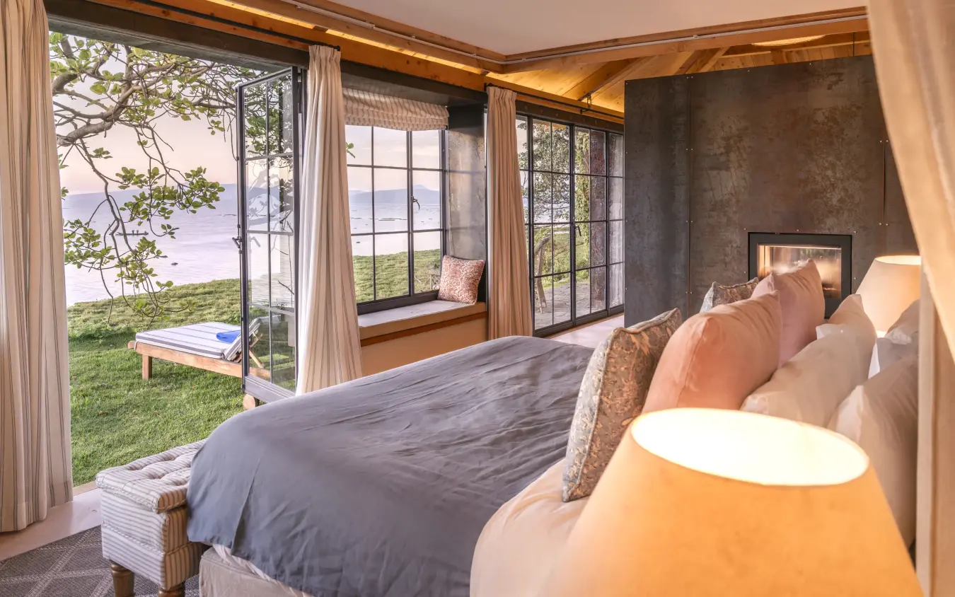 Luxury bedroom with ocean views and coastal landscape beyond, Loldia House, Rift Valley Lakes, Kenya