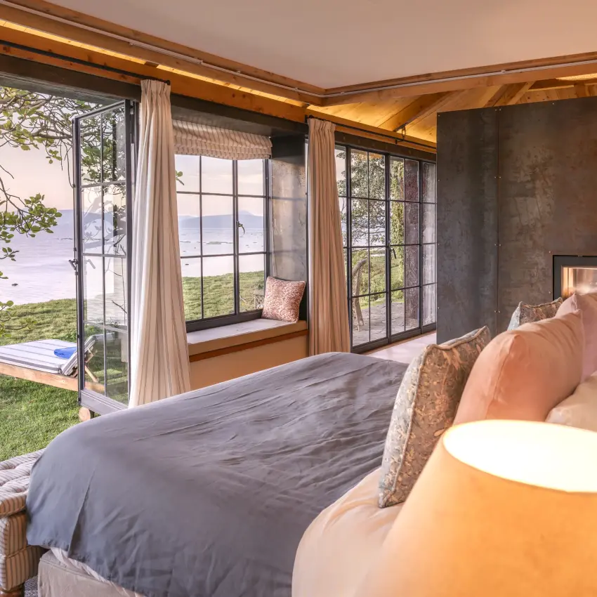 Luxury bedroom with ocean views and coastal landscape beyond, Loldia House, Rift Valley Lakes, Kenya