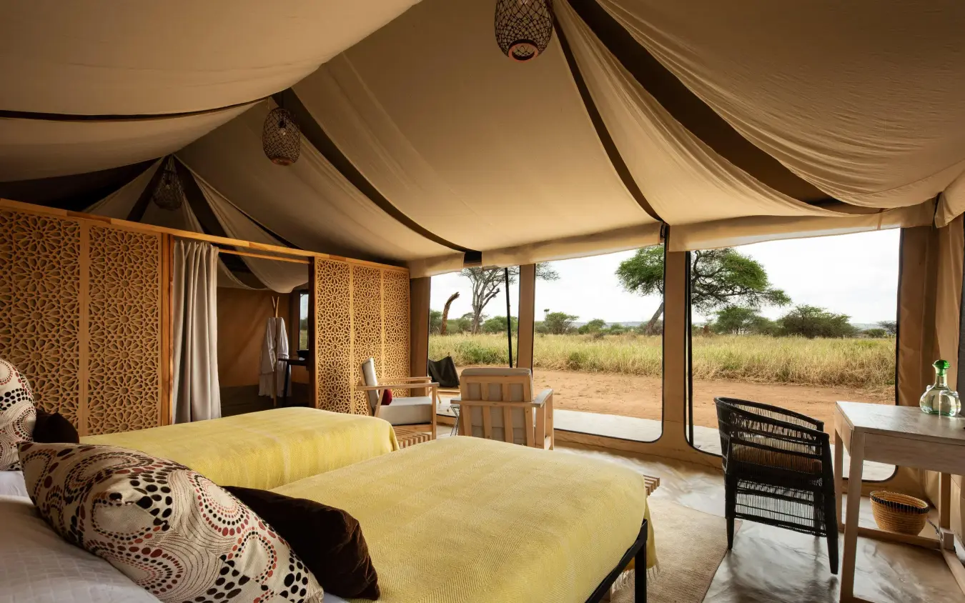Luxury safari tent bedroom with twin beds and savanna views, Lolkisale Camp, Tarangire National Park, Tanzania