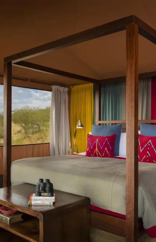 Luxury bedroom with four-poster bed and savanna views, Mahali Mzuri, Maasai Mara, Kenya