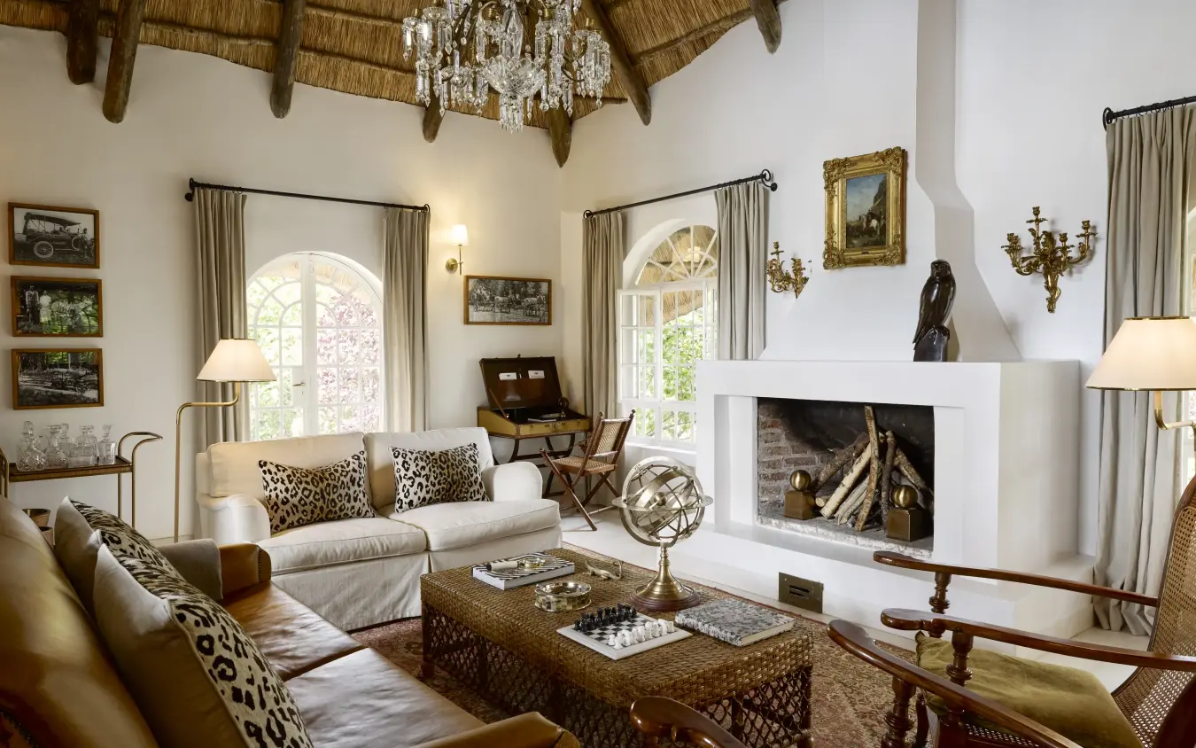 Luxury lounge interior with thatched ceiling and fireplace, Mama Simba, Arusha, Tanzania