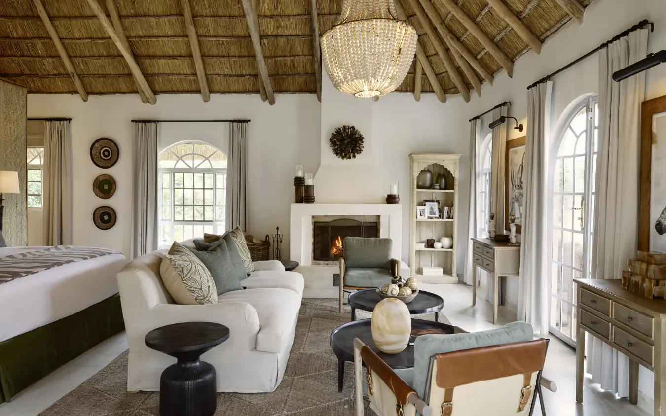 Luxury safari lodge suite with fireplace and open-air doors, Mama Simba, Arusha, Tanzania