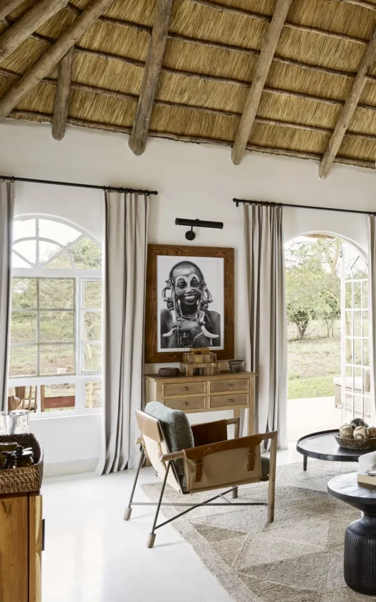 Thatched-roof lounge with large windows overlooking natural landscape, Mama Simba, Arusha, Tanzania