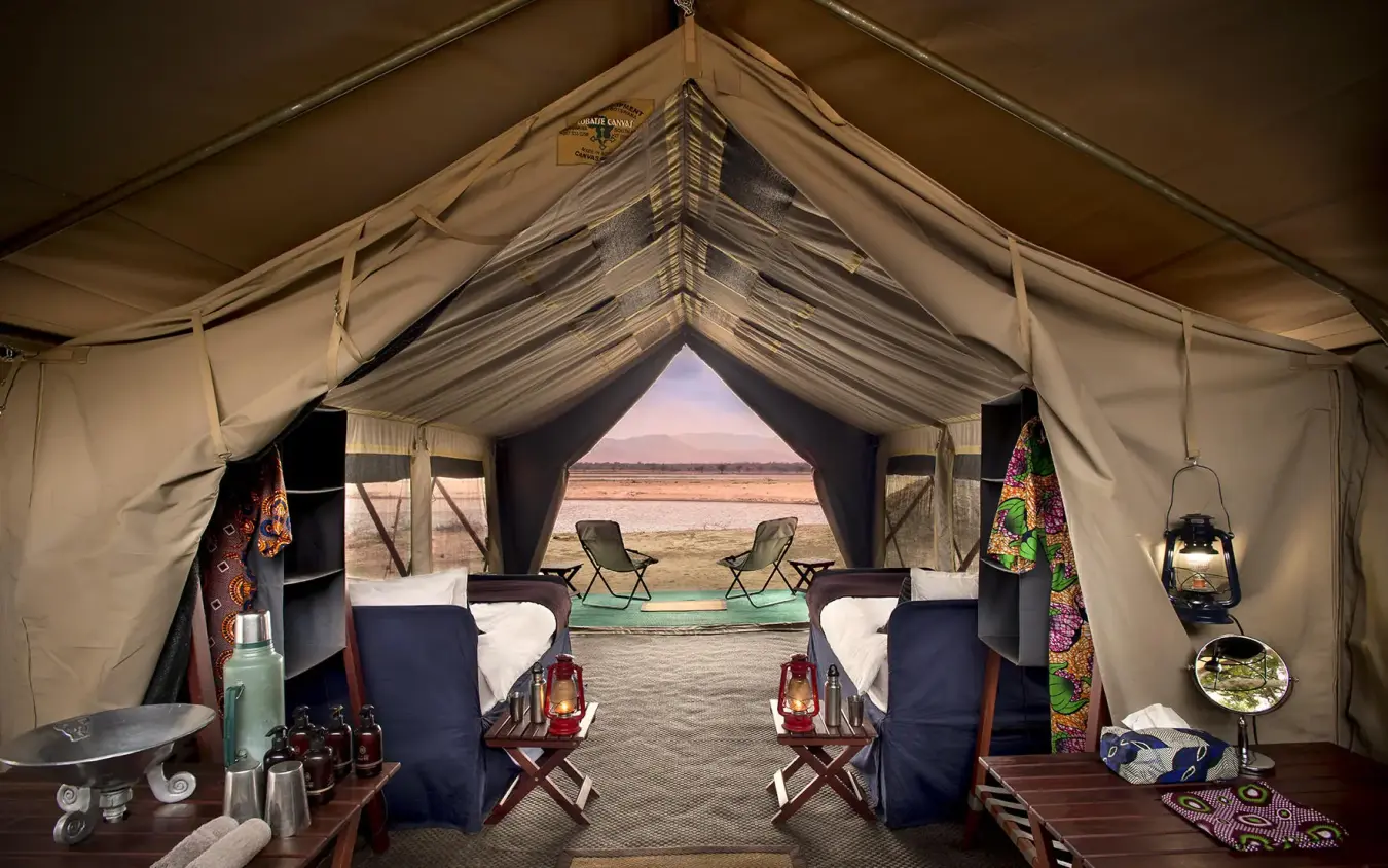Luxury safari tent interior with river view through central opening, Zambezi Expeditions, Mana Pools, Zimbabwe