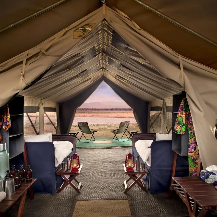 Luxury safari tent interior with river view through central opening, Zambezi Expeditions, Mana Pools, Zimbabwe