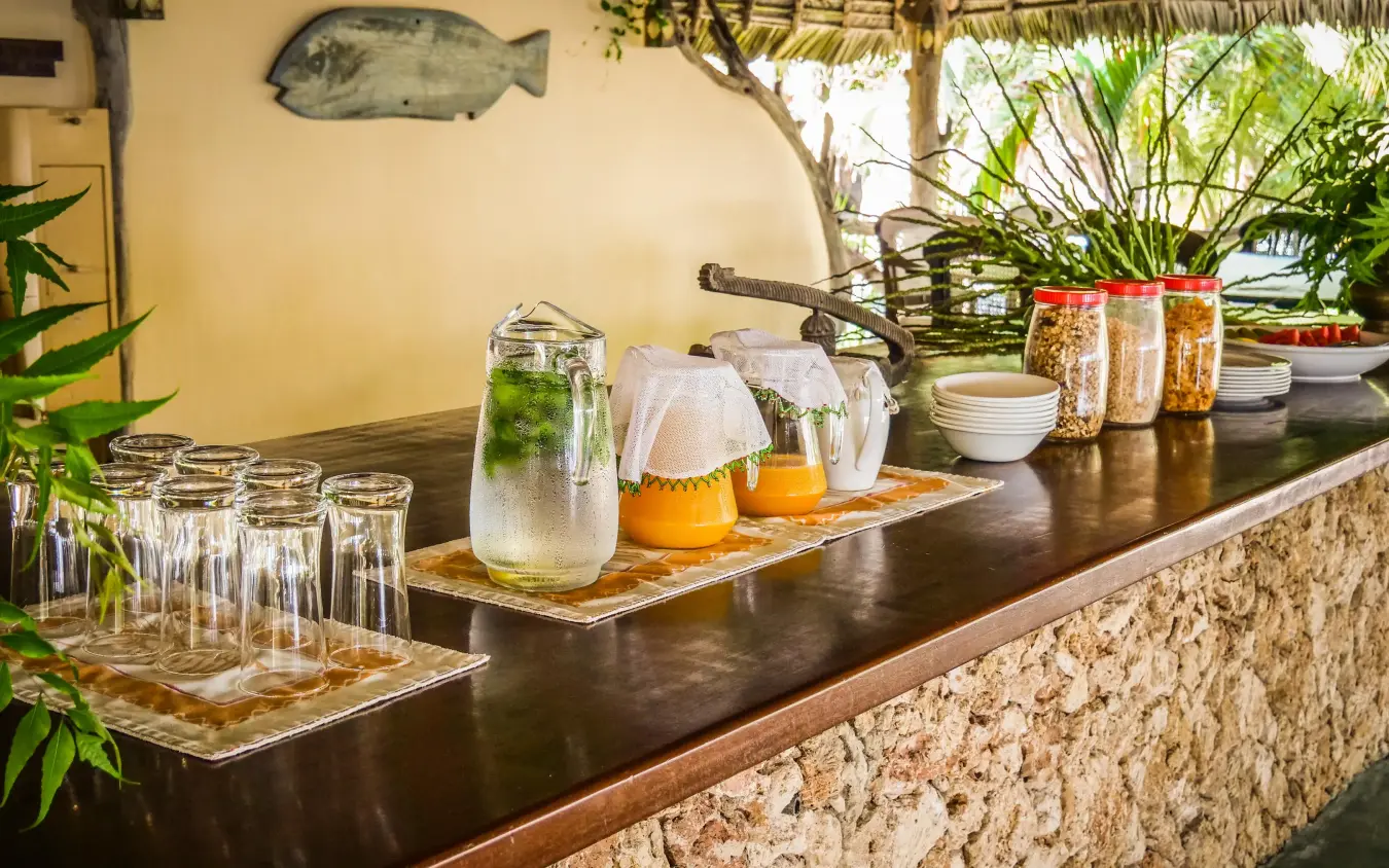 Bar counter with refreshing beverages and glassware display, Manda Bay, Lamu Archipelago, Kenya