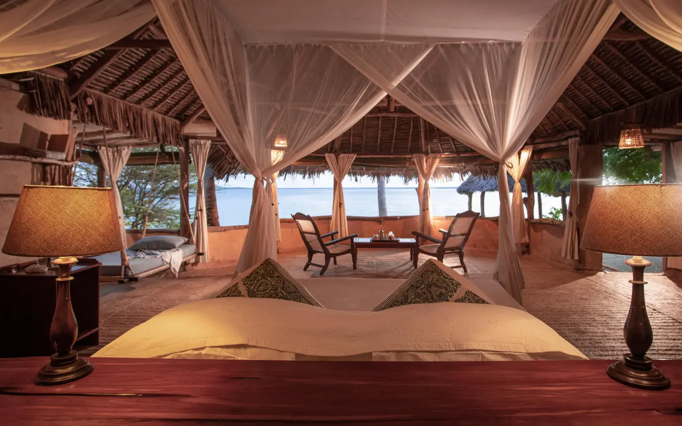 Beachfront bedroom with sheer canopy and ocean view, Manda Bay, Lamu Archipelago, Kenya