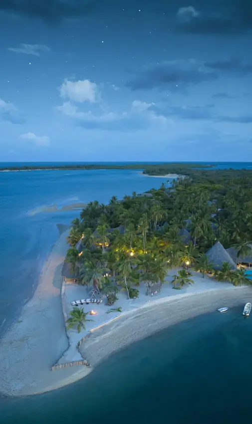 Aerial view of beachfront lodge surrounded by turquoise waters, Manda Bay, Lamu Archipelago, Kenya