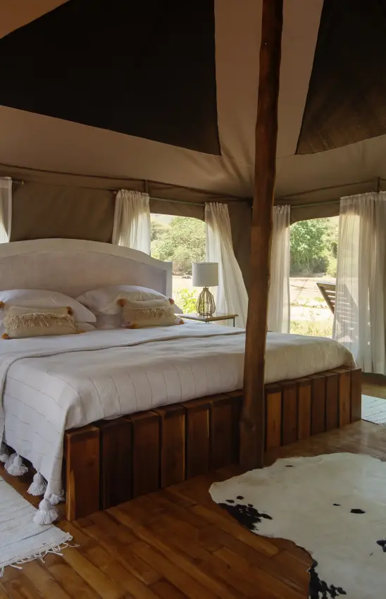 Spacious bedroom with canopy bed and canvas walls, Manyara Green Camp, Lake Manyara, Tanzania