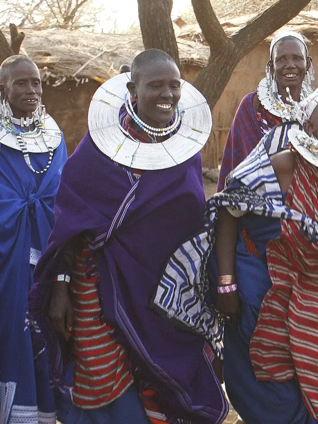 Maasai community members in traditional beaded jewelry and colorful fabrics, Manyara Ranch, Lake Manyara, Tanzania