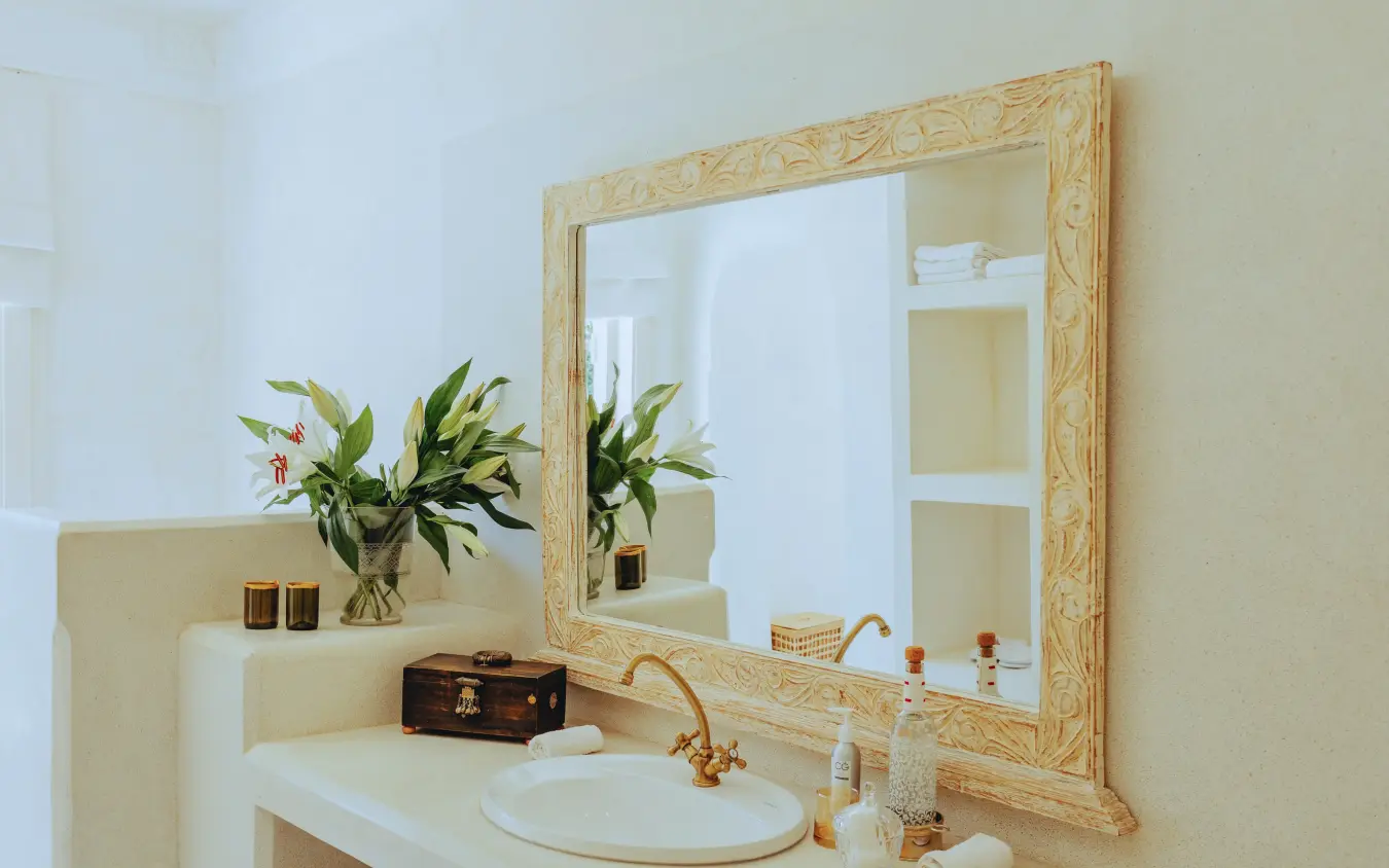Bathroom vanity with mirror, sink, and fresh flowers, Manzili House, Nairobi, Kenya