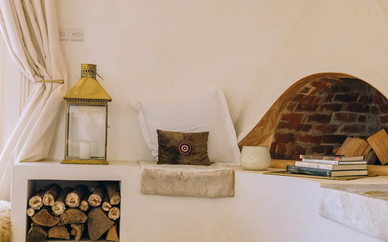 Curved alcove nook with cushions, books, and decorative objects, Manzili House, Nairobi, Kenya