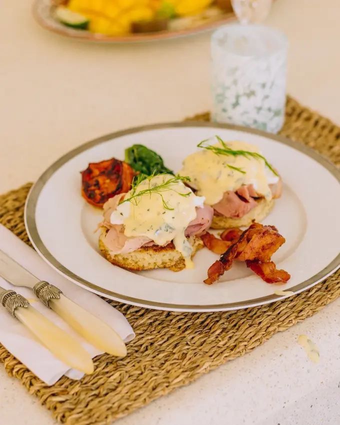Plated eggs Benedict with bacon and roasted tomatoes, Nairobi, Kenya