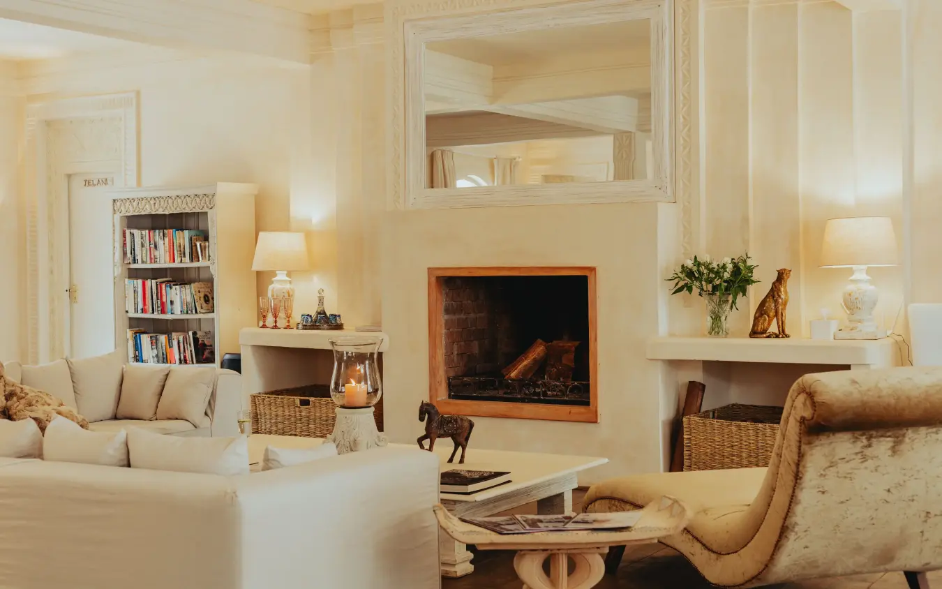 Elegant cream living room with fireplace and built-in shelving, Manzili House, Nairobi, Kenya