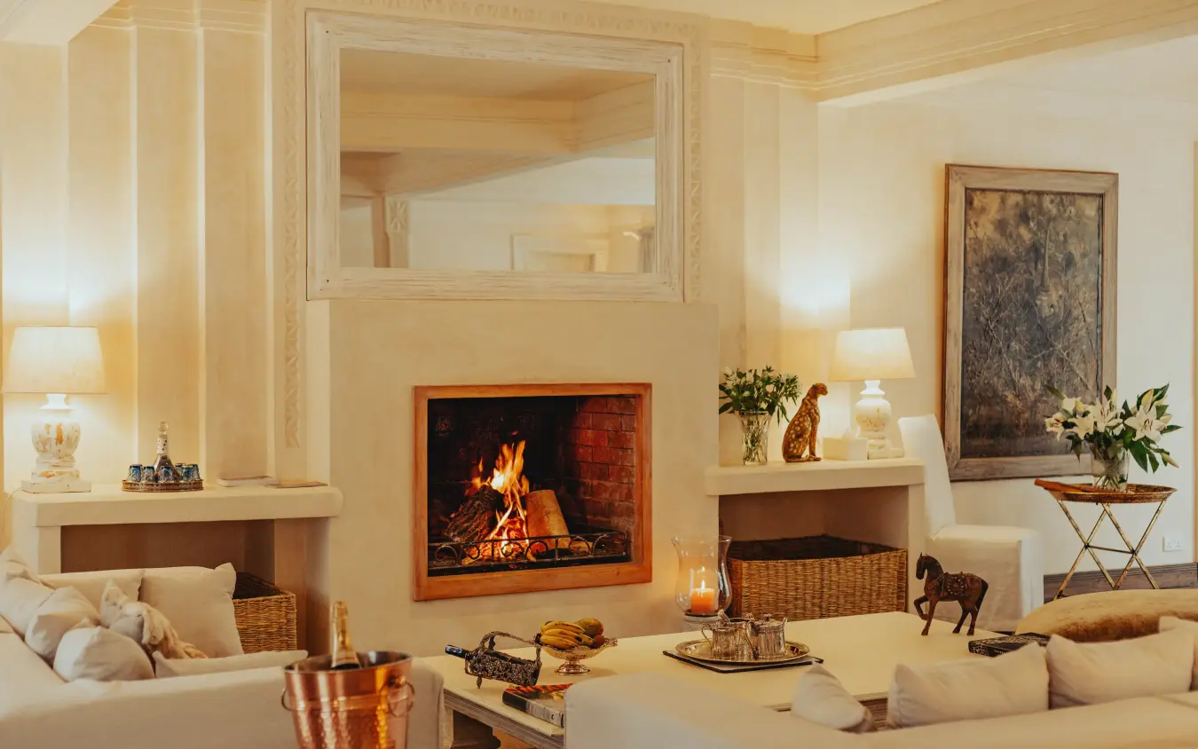 Elegant living room with fireplace and cream furnishings, Manzili House, Nairobi, Kenya
