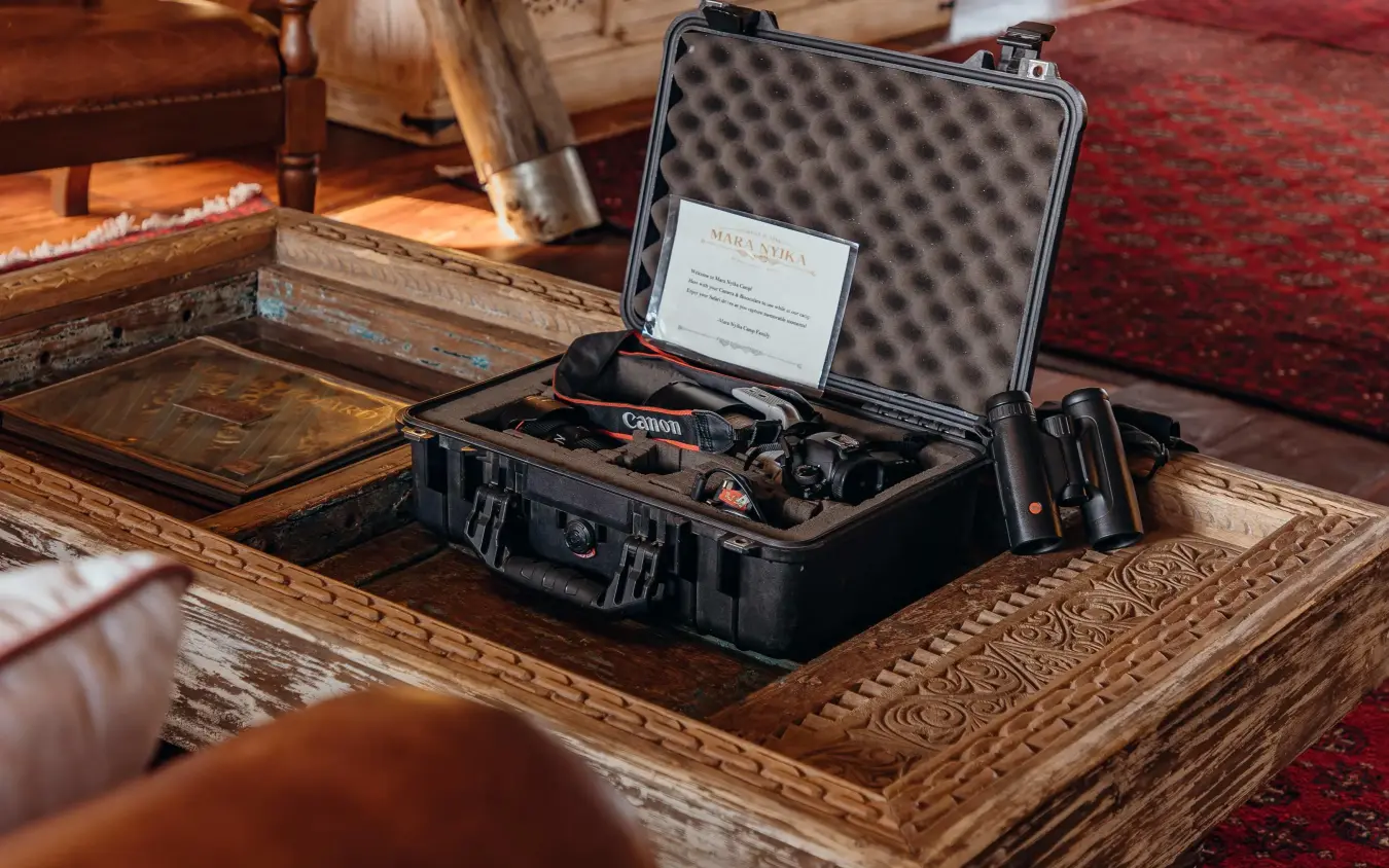 Professional camera equipment displayed in protective case indoors, Mara Nyika Camp, Maasai Mara, Kenya