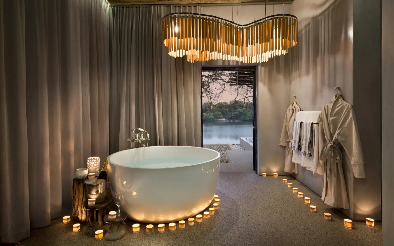 Luxurious spa bathroom with freestanding tub and river view, Matetsi River Lodge, Victoria Falls, Zimbabwe