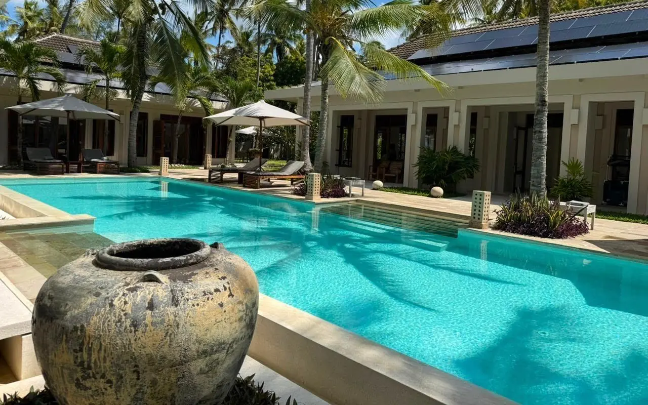 Luxury poolside villa with turquoise infinity pool and palm trees, Maya Kobe, Kilifi, Kenya