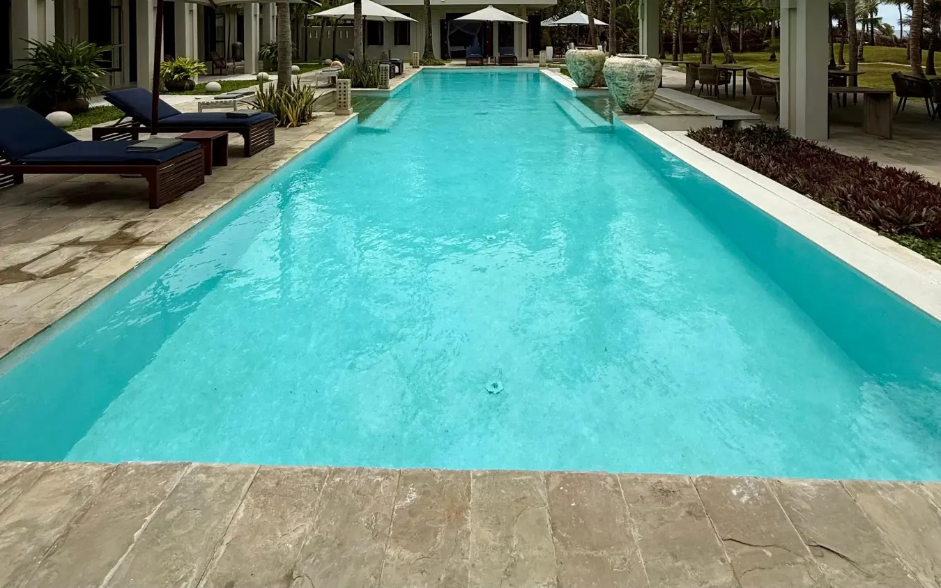 Rectangular lap pool with turquoise water adjacent to covered terrace, Maya Kobe, Kilifi, Kenya