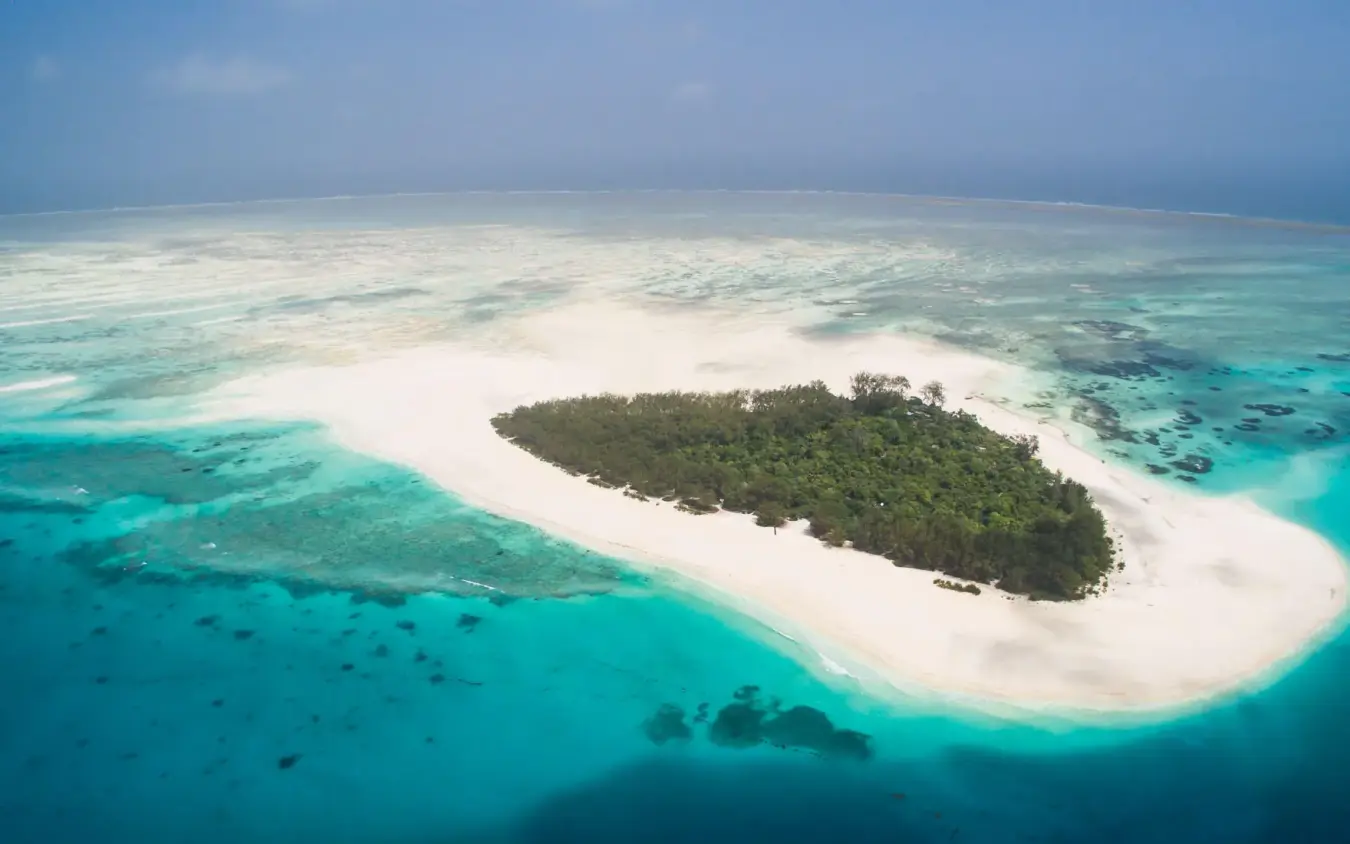 Tropical island with white sand beach surrounded by turquoise water, Mnemba Island, Zanzibar & Pemba, Tanzania